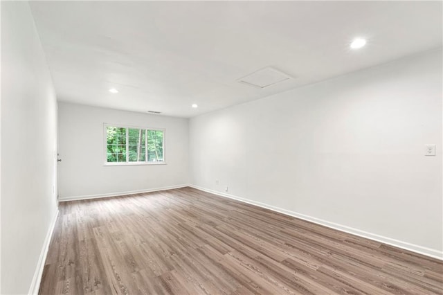 unfurnished room featuring hardwood / wood-style flooring