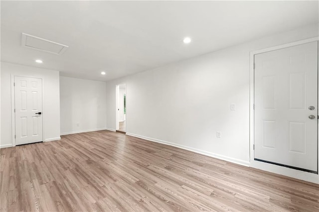 spare room featuring light hardwood / wood-style flooring