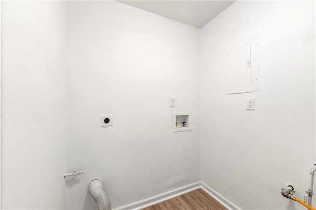 laundry room featuring wood-type flooring, hookup for a gas dryer, washer hookup, electric panel, and hookup for an electric dryer