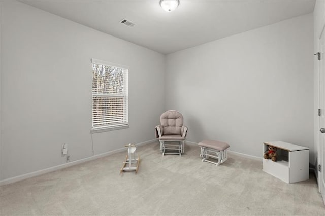 unfurnished room with baseboards and light carpet