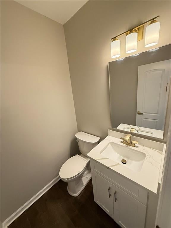 unfurnished room with baseboards, a chandelier, and dark wood-style flooring