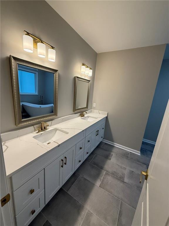 bathroom featuring toilet, vanity, a marble finish shower, and tile patterned floors