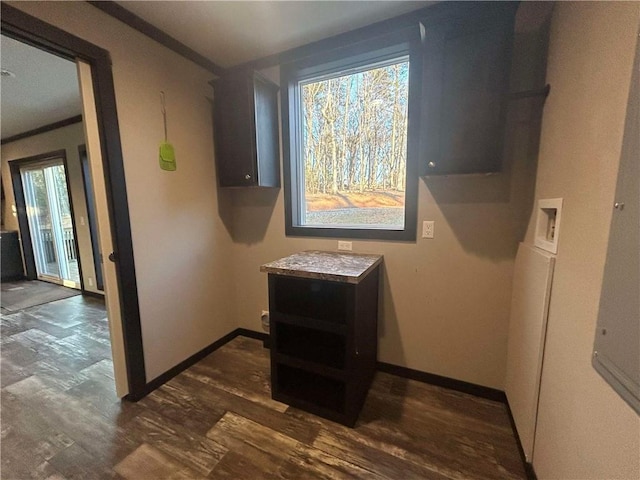 interior space with dark wood-type flooring and baseboards