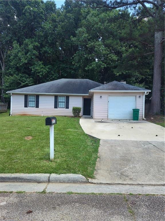 2322 Wilkins Ct, Decatur, GA 30035 - ranch-style home featuring driveway, a front yard, and a garage