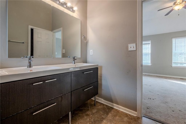 bathroom featuring ceiling fan, tile patterned flooring, and vanity