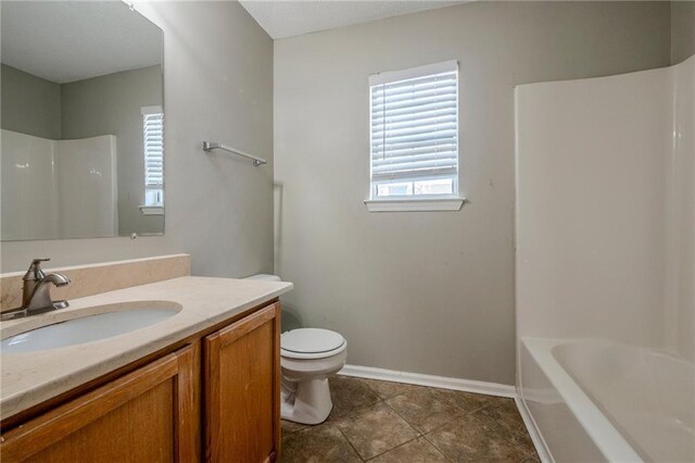 full bathroom featuring tile patterned flooring, vanity, toilet, and tub / shower combination