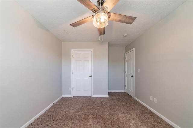 unfurnished bedroom with carpet floors, a ceiling fan, and baseboards