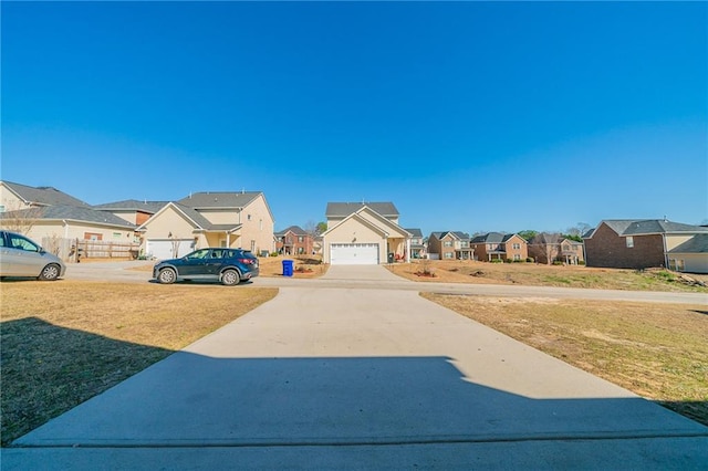 view of yard with a garage and a residential view