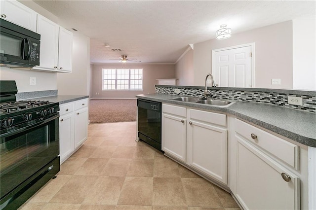 kitchen with a sink, white cabinetry, backsplash, black appliances, and dark countertops