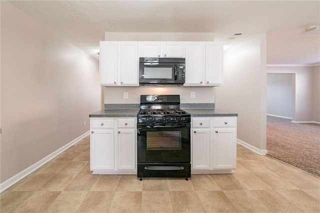 kitchen featuring dark countertops, baseboards, white cabinets, and black appliances