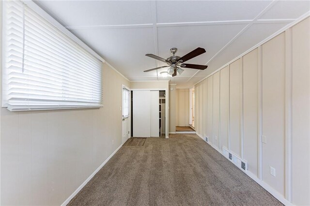 2363 Dabney Ter, Atlanta, GA 30344 - carpeted empty room featuring ceiling fan, a healthy amount of sunlight, and ornamental molding
