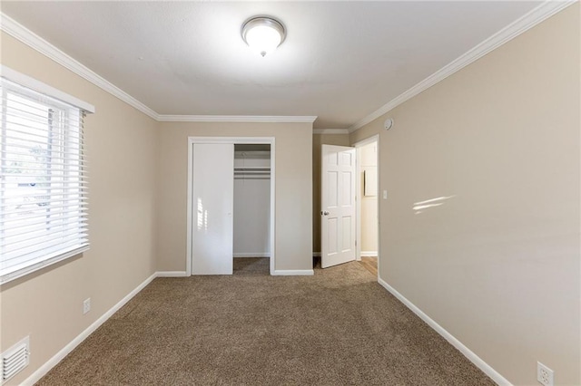 2363 Dabney Ter, Atlanta, GA 30344 - unfurnished bedroom with carpet flooring, crown molding, and a closet