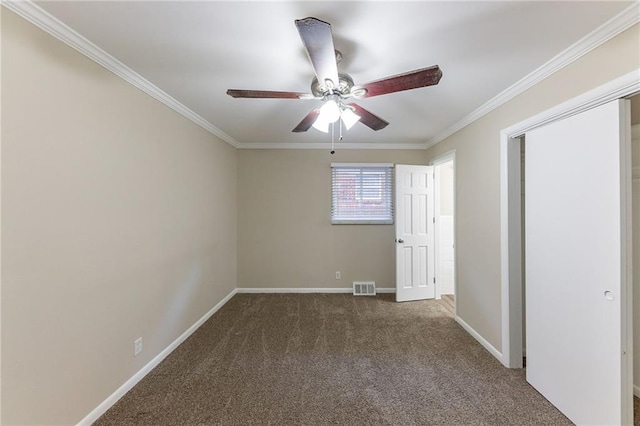 2363 Dabney Ter, Atlanta, GA 30344 - unfurnished bedroom with dark colored carpet, ceiling fan, and ornamental molding
