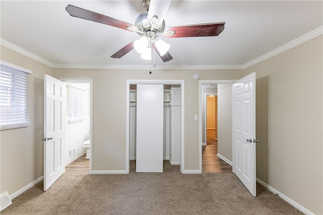 2363 Dabney Ter, Atlanta, GA 30344 - unfurnished bedroom with connected bathroom, ceiling fan, crown molding, and light carpet