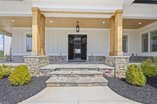 doorway to property featuring covered porch