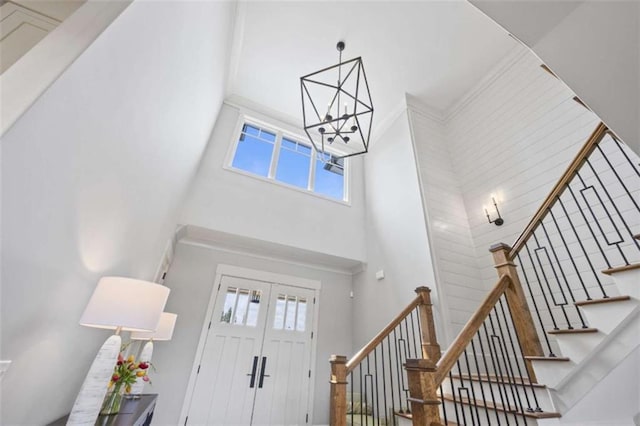 foyer featuring a towering ceiling