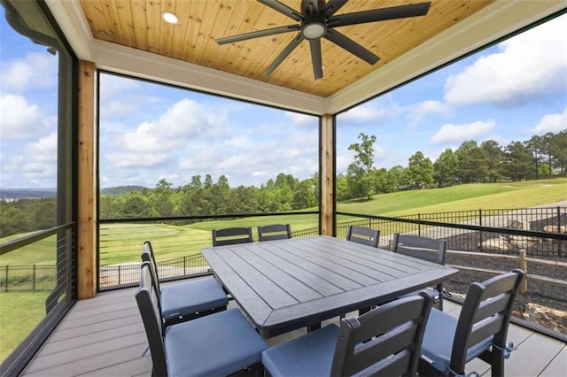 exterior space featuring plenty of natural light, ceiling fan, and wood ceiling