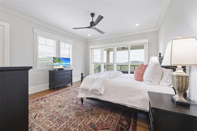 bedroom with hardwood / wood-style flooring, ceiling fan, and crown molding