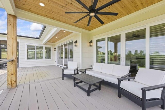 wooden deck with an outdoor living space