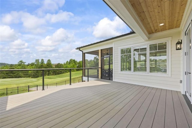 wooden deck with a sunroom