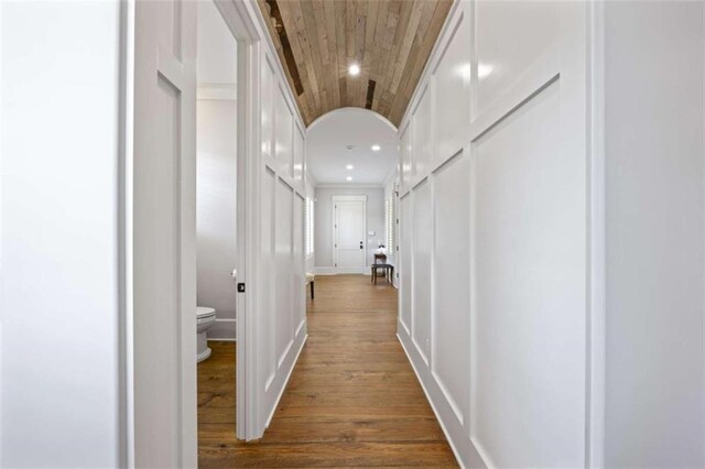 hall featuring wooden ceiling and hardwood / wood-style flooring