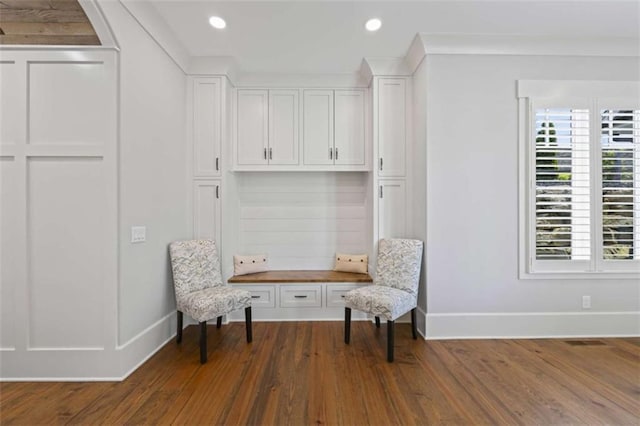 sitting room with dark wood-type flooring