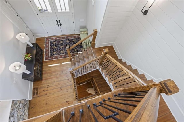 staircase featuring hardwood / wood-style flooring