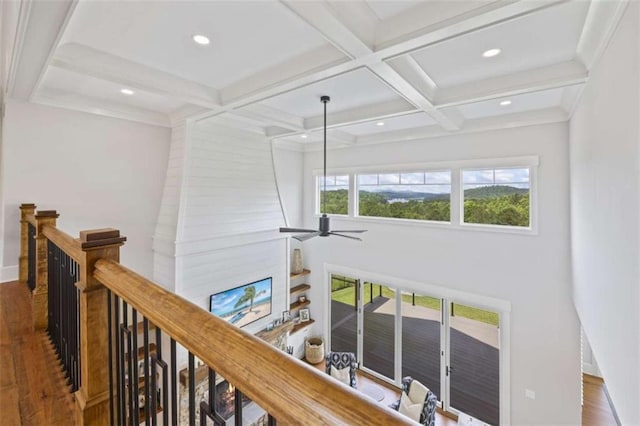 corridor featuring beam ceiling, dark wood-type flooring, and coffered ceiling