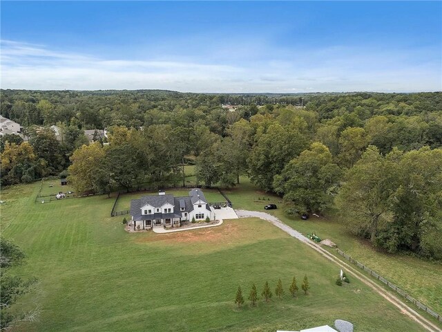 birds eye view of property with a rural view