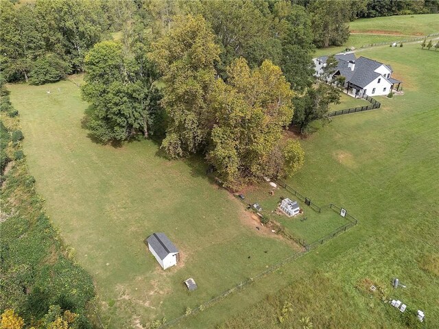 birds eye view of property featuring a rural view