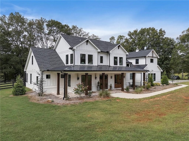 modern farmhouse style home featuring a front yard and a porch