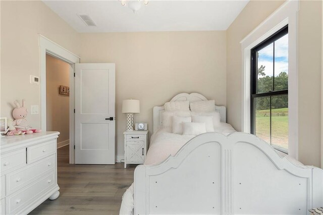 bedroom featuring dark wood-type flooring