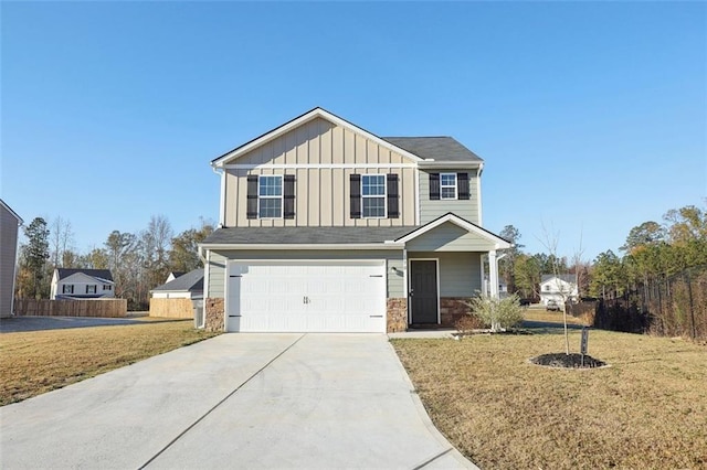 view of front of house with a front yard and a garage