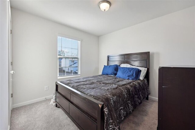 bedroom with light carpet