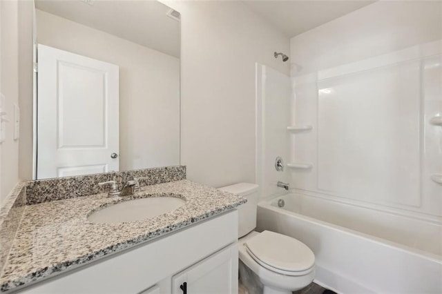 full bathroom featuring vanity, shower / bathing tub combination, and toilet