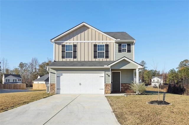 view of front of property featuring a garage and a front yard