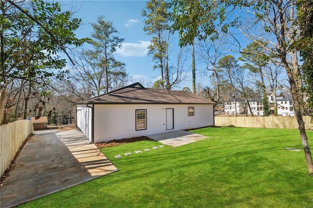 back of property with a patio area and a lawn