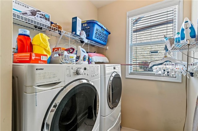 laundry area featuring washing machine and dryer and laundry area