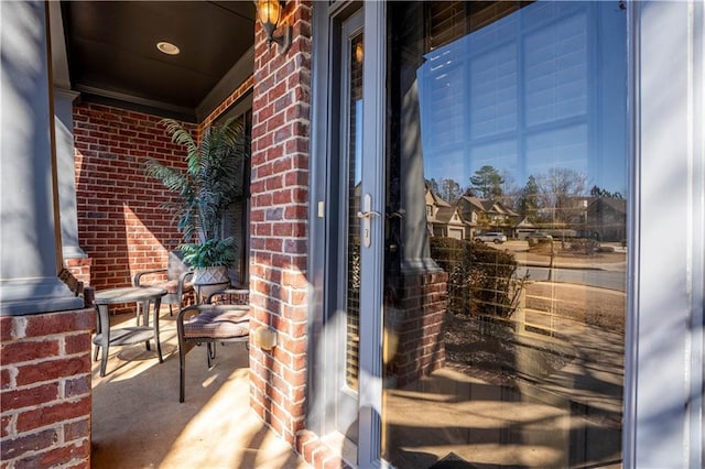 property entrance with brick siding