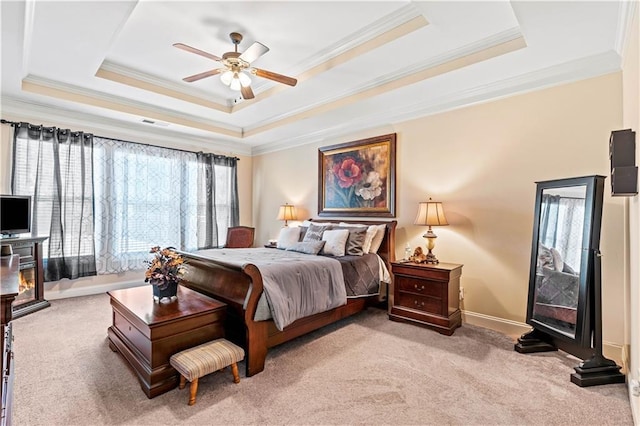 bedroom featuring light colored carpet, crown molding, and a raised ceiling