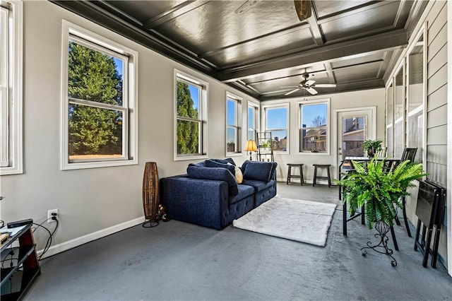 sunroom featuring beamed ceiling, coffered ceiling, and ceiling fan