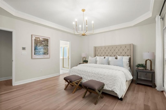 bedroom featuring a tray ceiling, a chandelier, light wood-style floors, crown molding, and baseboards