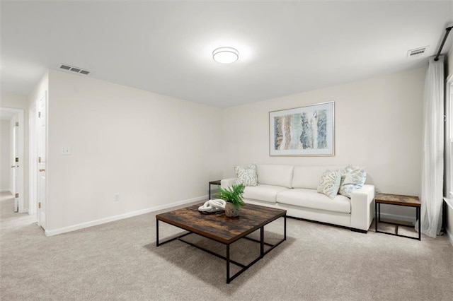 living area featuring carpet floors and baseboards