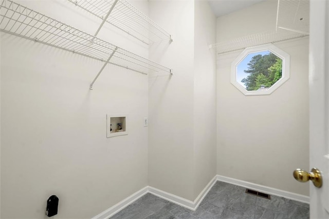 laundry room featuring hookup for a washing machine and baseboards