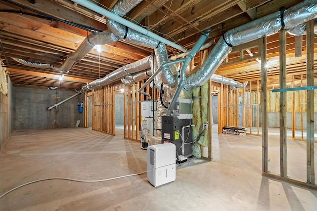 unfinished basement featuring gas water heater and heating unit