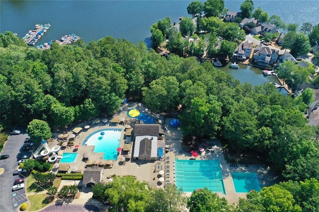 view of property location featuring a pool and a large body of water