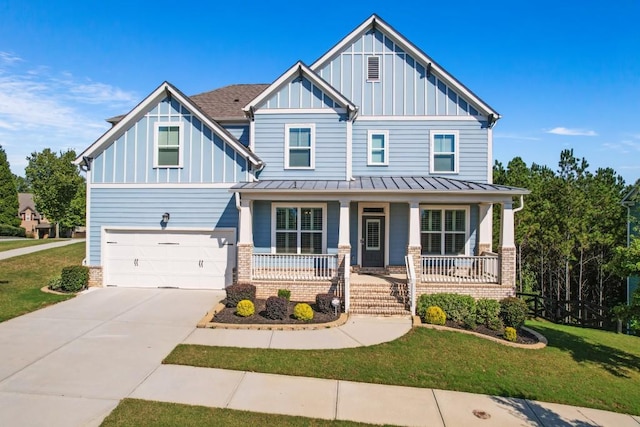 craftsman-style house featuring a garage, a porch, and a front lawn