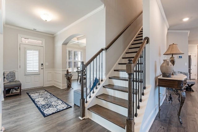 entryway featuring crown molding and wood-type flooring