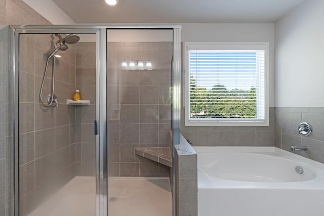 bathroom featuring plus walk in shower