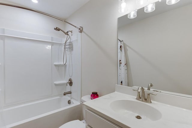 bathroom with vanity, toilet, and shower / tub combo